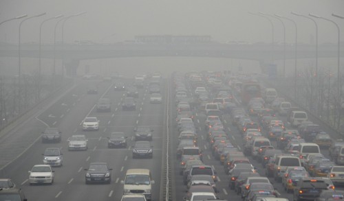 (FILES) -- A file photo taken on January 29,2013 shows cars driving on an eight lane expressway in Beijing. China, the United States and Qatar were accused of environmental plunder on August 20, 2013 as green activists marked "Earth Overshoot Day," the date at which mankind has exhausted a year's budget of natural resources. AFP PHOTO / WANG ZHAOWANG ZHAO/AFP/Getty Images